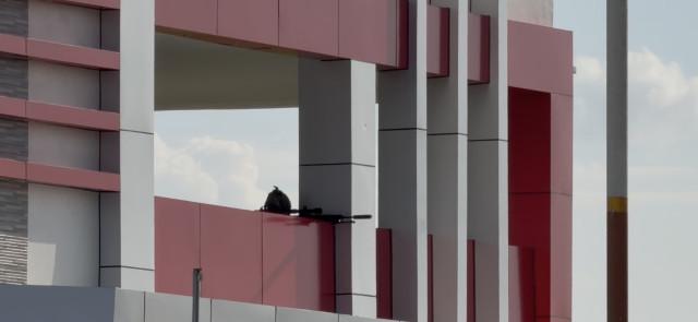 SAF sniper positions himself on the top floor of a building to get a clear view of the surrounding and enemy targets.