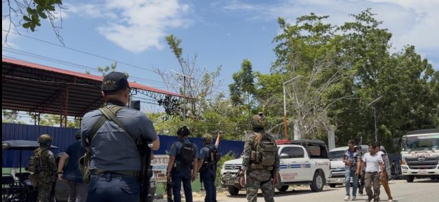 Cops launch a drone to check the gunbattle between two armed groups supporting rival political parties taking part in the BARMM parliamentary elections.