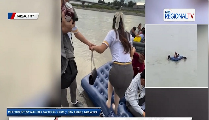 Ilang estudyante, sumasakay sa airbed upang makatawid sa ilog para makapasok sa paaralan sa Tarlac City