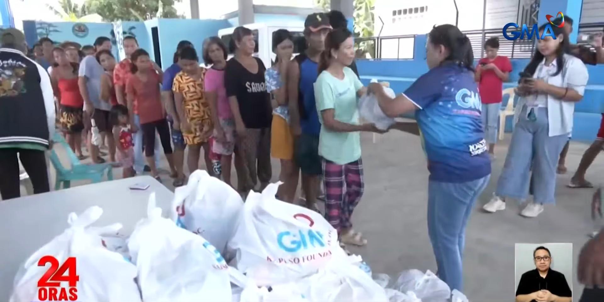 Over 1k families in Pangasinan, La Union affected by flooding receive aid from GMA Kapuso Foundation - GMA Network