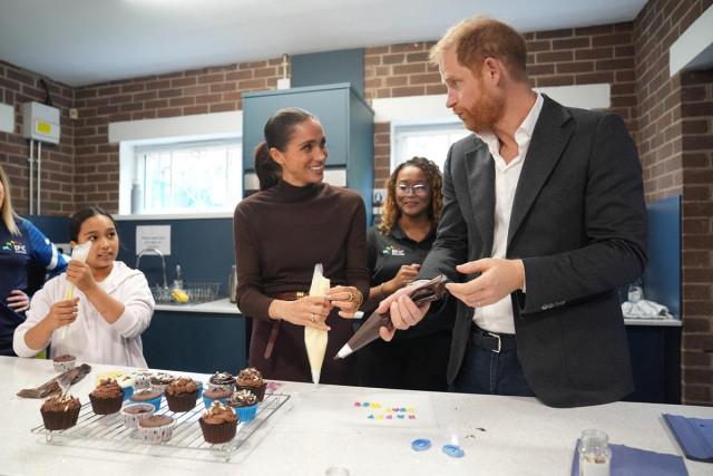 Prince Harry and Meghan, the Duke and Duchess of Sussex, decorate birthday cupcakes during a visit to Epic Partners in Nottingham, Britain October 15, 2026. Joe Giddens/ Pool via REUTERS