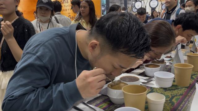 Visitors sample Philippine coffee during a cupping session at SCAJ 2026. Photo: Jay-vee Marasigan Pangan