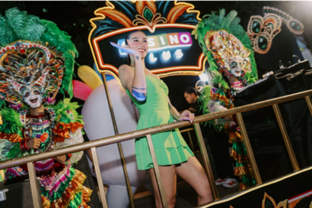 Social media star Zeinab Harake Parks greeted cheering spectators during the float parade.