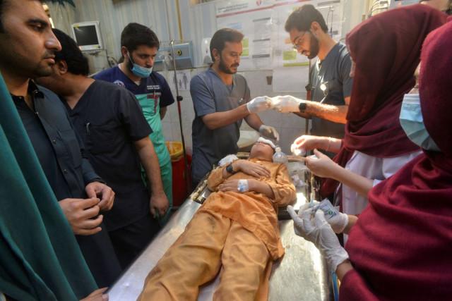 A boy who was injured after a school roof collapse receives first aid at a hospital in Peshawar, Pakistan, October 15, 2026. REUTERS